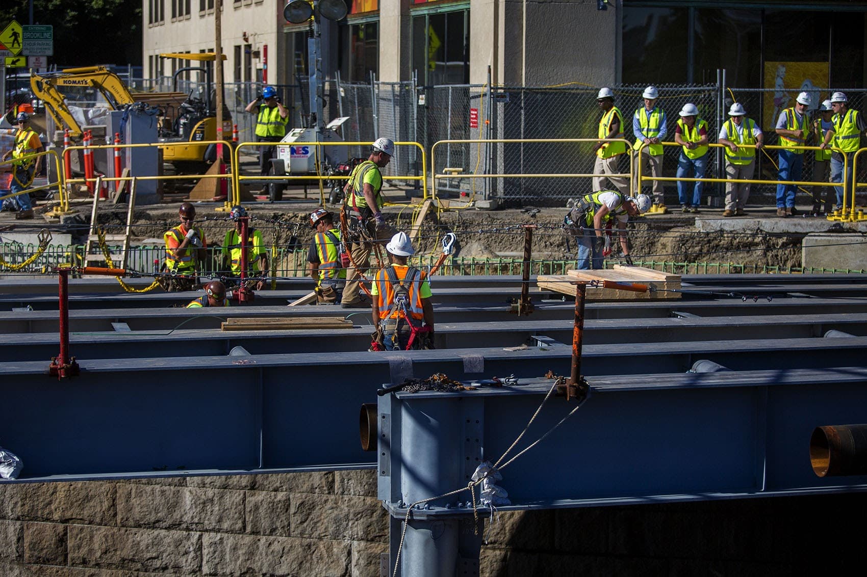 Contractors work on replacing the eastbound side of the Commonwealth Avenue Bridge on July 31, 2017. (Jesse Costa/WBUR)