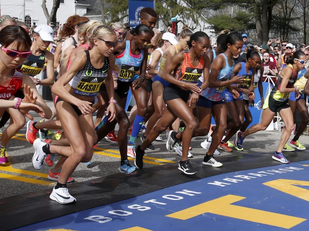 In this Monday, April 17, 2017 photo, Jordan Hasay, left, of Beaverton, Ore., breaks from the starting line with the elite women at the start of the 2017 Boston Marathon in Hopkinton, Mass. It was Hasay's first competition at the 26.2-mile distance, and she finished in third place in the women's division. (AP Photo/Mary Schwalm)