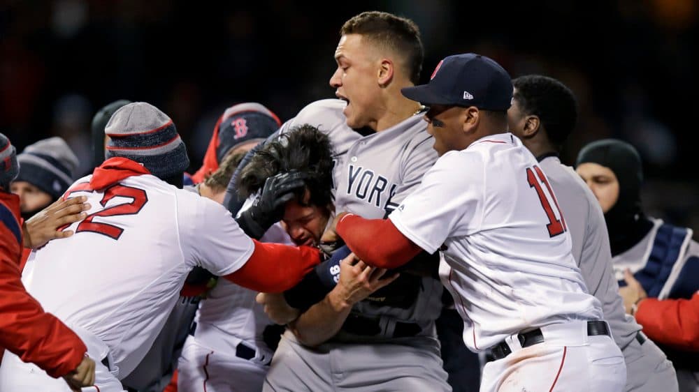 New York Yankees right fielder Aaron Judge puts Boston Red Sox relief pitcher Joe Kelly in a headlock after Kelly hit Yankees' Tyler Austin with a pitch during the seventh inning of a baseball game at Fenway Park in Boston, Wednesday, April 11, 2018. (Charles Krupa/AP)