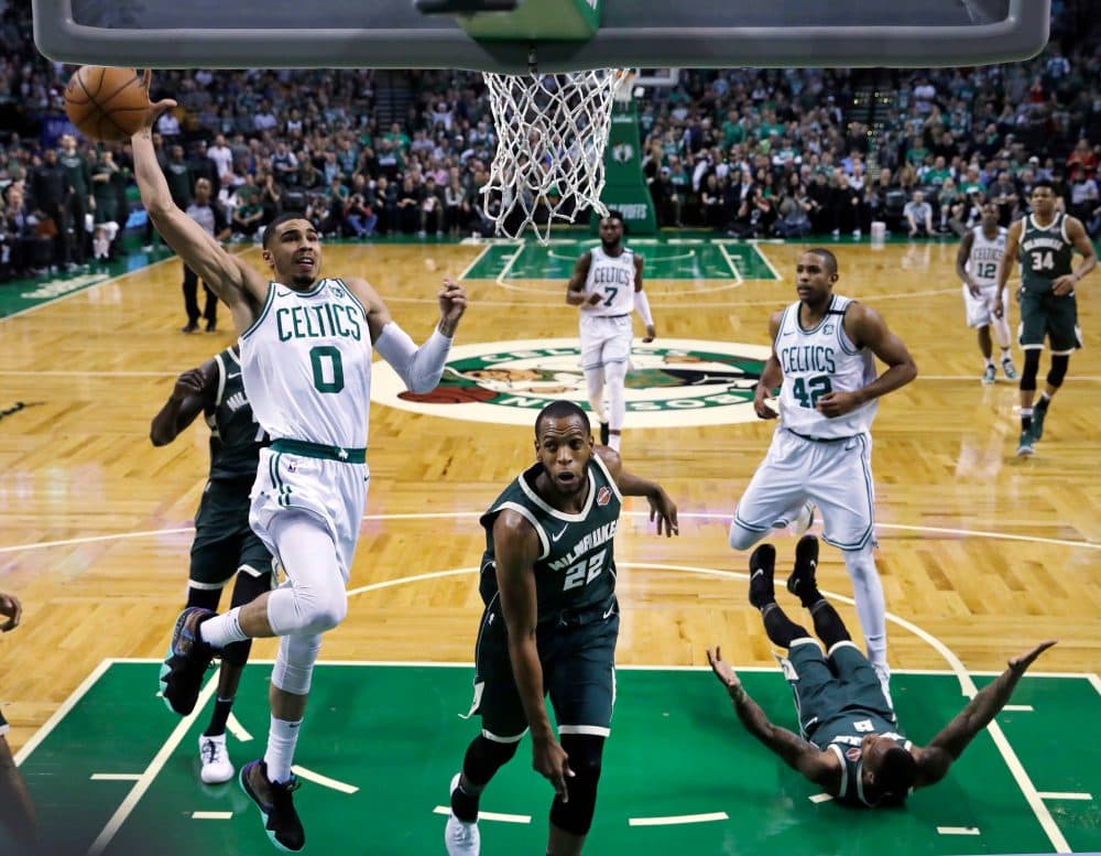Boston Celtics forward Jayson Tatum (0) drives to the basket against Milwaukee Bucks forward Khris Middleton (22) during the first quarter of Game 7 of an NBA basketball first-round playoff series in Boston, Saturday, April 28, 2018. (Charles Krupa/AP)