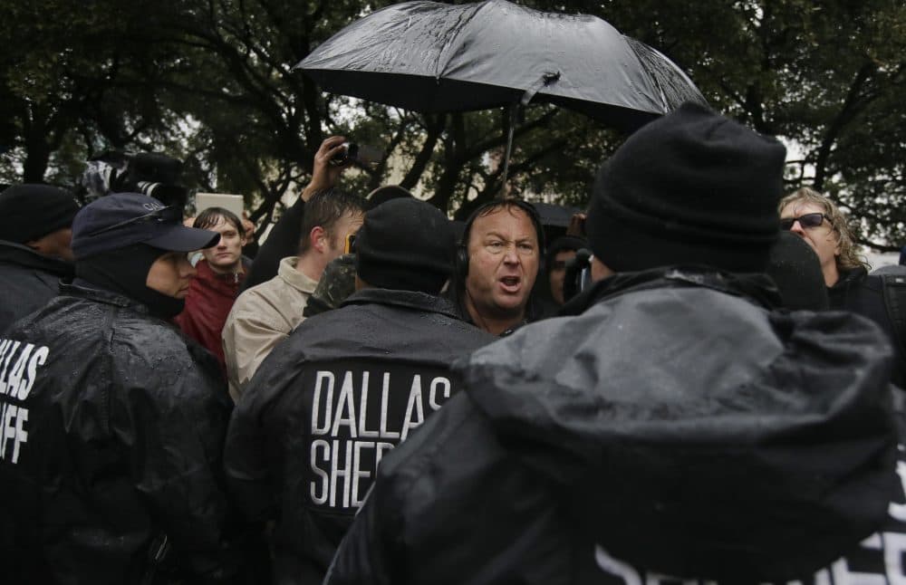 Talk show host Alex Jones leads a protest after a ceremony to mark the 50th anniversary of the assassination of John F. Kennedy, Friday, Nov. 22, 2013, at Dealey Plaza in Dallas. (Tony Gutierrez/AP)