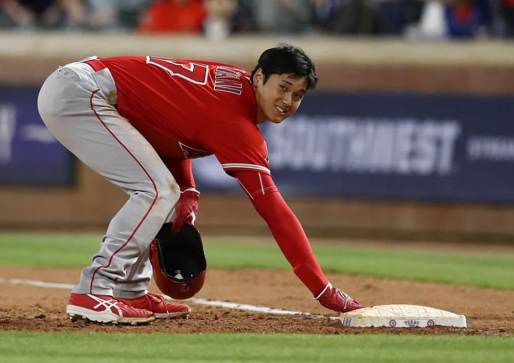 Whether pitching, hitting or getting picked off of first base, Angels' rookie Shohei Ohtani loves baseball. And he wants to play more of it. (Ronald Martinez/Getty Images)