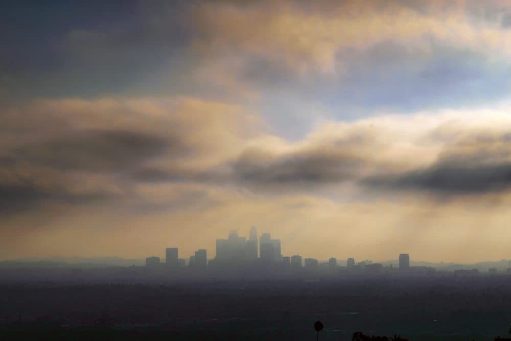FILE - In this Aug. 12, 2016, file photo, downtown Los Angeles is shrouded in early morning coastal fog. California air regulators voted Friday, March 24, 2017, to keep the state's tough vehicle emissions standards through 2025. The state Air Resources Board voted unanimously at a meeting in Riverside to continue with the standards for 2022 to 2025 after reaching a conclusion similar to one by the U.S. Environmental Protection Agency under the Obama administration. (AP Photo/Richard Vogel, File)