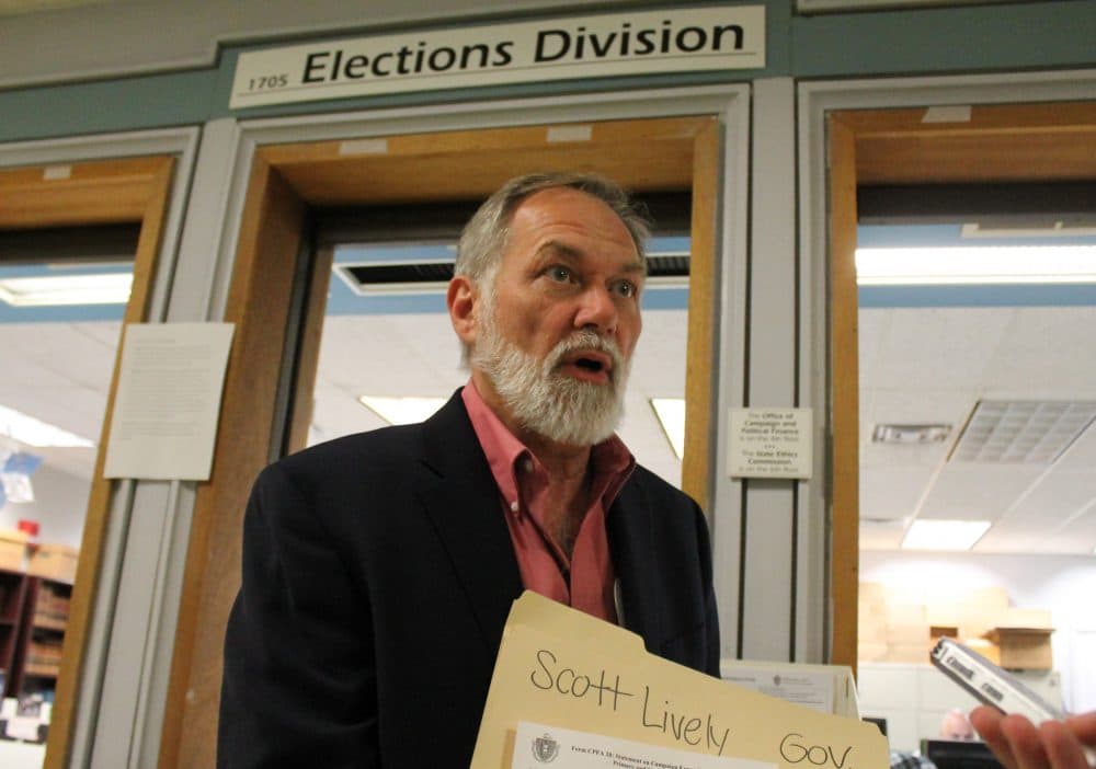 After turning in some of his ballot signatures Tuesday afternoon, pastor Scott Lively called on his primary opponent Gov. Charlie Baker to &quot;come on out, come out of hiding&quot; and debate. (Sam Doran/SHNS)