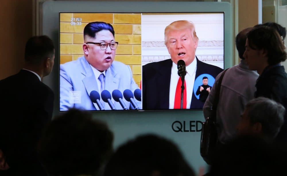 In this April 21, 2018 file photo, people watch a TV screen showing file footage of U.S. President Donald Trump, right, and North Korean leader Kim Jong Un during a news program at the Seoul Railway Station in Seoul, South Korea. (Ahn Young-joon, File/AP)