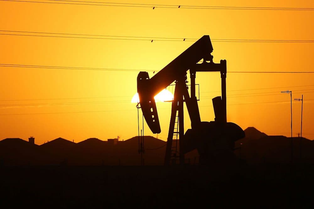 A pumpjack sits on the outskirts of town at dawn in the Permian Basin oil field on January 21, 2016 in the oil town of Midland, Texas. (Spencer Platt/Getty Images)