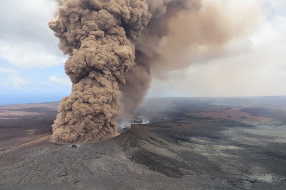 This Friday, May 4, 2018, aerial image released by the U.S. Geological Survey, at 12:46 p.m. HST, a column of robust, reddish-brown ash plume occurred after a magnitude 6.9 South Flank of Kilauea earthquake shook the Big Island of Hawaii, Hawaii. The Kilauea volcano sent more lava into Hawaii communities Friday, a day after forcing more than 1,500 people to flee from their mountainside homes, and authorities detected high levels of sulfur gas that could threaten the elderly and people with breathing problems. (U.S. Geological Survey via AP)