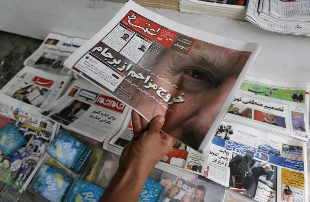 An Iranian displays the front page of a newspaper in Tehran on May 9, 2018 a day after President Trump announced the U.S. is pulling out of the nuclear deal. (Atta Kenare/AFP/Getty Images)