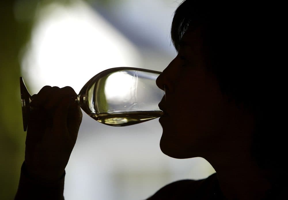 A woman participates in a wine tasting in California. (Justin Sullivan/Getty Images)