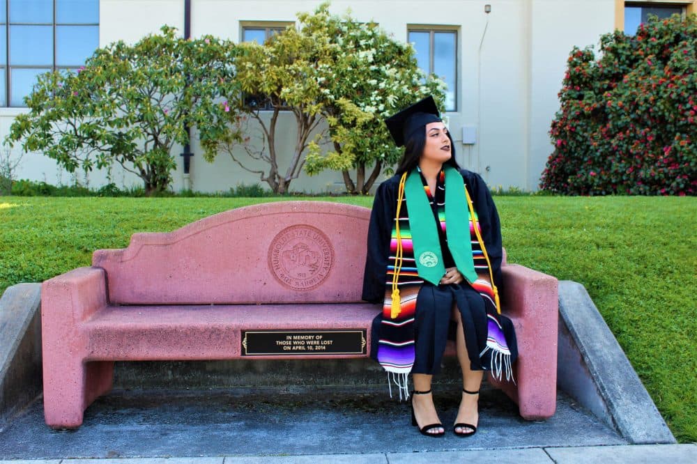 Rosibeth Cuevas, 21, sits on a bench that was dedicated to those who died in a bus crash in Orland, Calif., in 2014. Cuevas is one of the survivors of the crash and is now graduating from Humboldt State University. (Courtesy Sofia Tam)