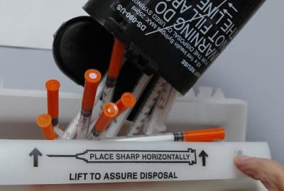 Hypodermic needles are disposed of at a clinic, Friday, Jan. 20, 2012. (Robert F. Bukaty/AP)