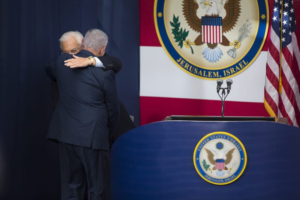U.S. ambassador to Israel David Friedman and Israel's Prime Minister Benjamin Netanyahu embrace onstage during the opening of the U.S. Embassy in Jerusalem on May 14, 2018 in Jerusalem, Israel. Trump recognized Jerusalem as Israel's capital in December, and announced an embassy move from Tel Aviv, prompting deadly protests in Gaza. (Lior Mizrahi/Getty Images,)