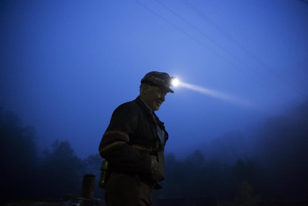 In this May 2016 photo, coal miner Scott Tiller prepares to head into an underground mine less than 40-inches high at dusk in Welch, W.Va. (David Goldman/AP)