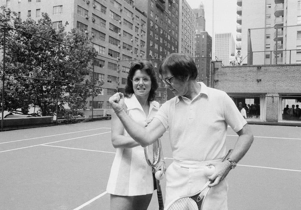 Wimbledon champion Billie Jean King checks the muscle on her nemesis, Bobby Riggs, in New York, July 11, 1973. (Anthony Camerano/AP)