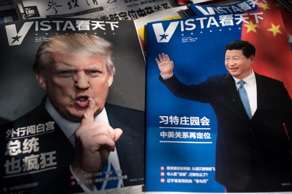 Magazines featuring front pages of President Trump and China's President Xi Jinping are displayed at a news stand in Beijing on April 6, 2017. (Nicolas Asfouri/AFP/Getty Images)