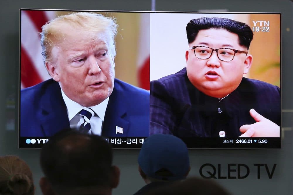 People watch a TV screen showing file footage of U.S. President Donald Trump, left, and North Korean leader Kim Jong Un during a news program at the Seoul Railway Station in Seoul, South Korea, Thursday, May 24, 2018.  (Ahn Young-joon/AP)