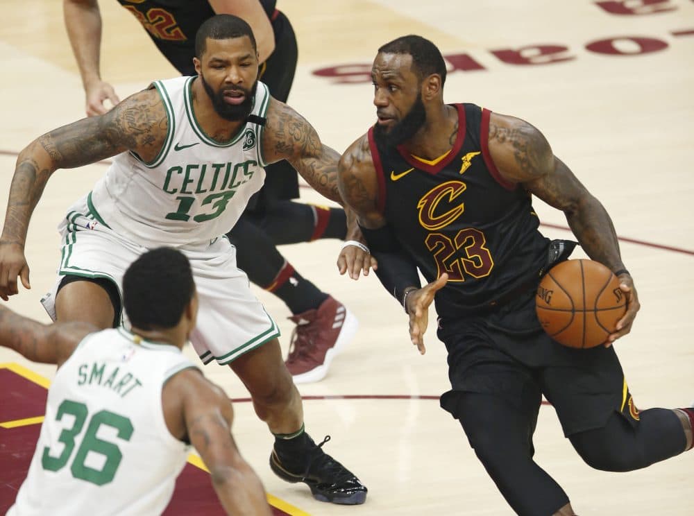Cleveland Cavaliers' LeBron James (23) drives between Boston Celtics' Marcus Morris (13) and Boston Celtics' Marcus Smart (36) Friday during Game 6 of the NBA basketball Eastern Conference finals. (Ron Schwane/AP)