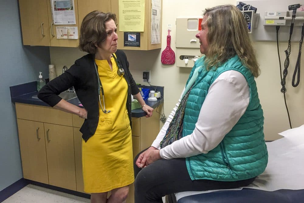 During a routine primary care checkup, Dr. Rebecca Lee opens a difficult conversation with Stacey Regal-O’Hare, who has a serious illness: &quot;What are your goals for the end of life?&quot; (Martha Bebinger/WBUR)
