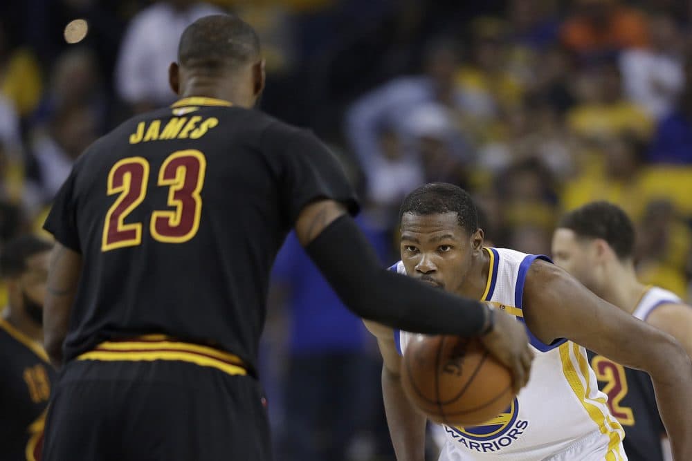 Golden State Warriors forward Kevin Durant, right, defends Cleveland Cavaliers forward LeBron James (23) during the first half of Game 5 of basketball's NBA Finals in Oakland, Calif., Monday, June 12, 2017. (Marcio Jose Sanchez/AP)