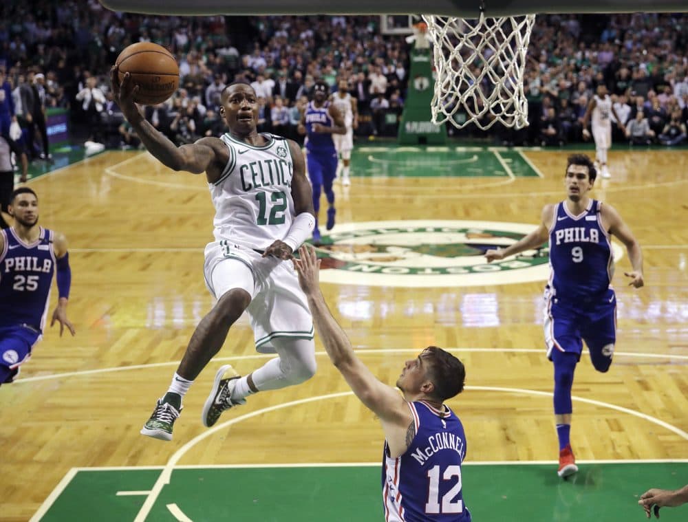 Boston Celtics guard Terry Rozier (12) drives to the basket against the Philadelphia 76ers during the second half of Game 5 of an NBA basketball playoff series in Boston, Wednesday, May 9, 2018. Rozier scored 24 points as the Celtics defeated the 76ers 114-112. (Charles Krupa/AP)