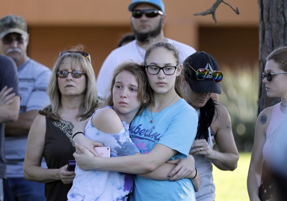 Mourners wait for the start of a prayer vigil following a deadly shooting at Santa Fe High School in Santa Fe, Texas, on Friday, May 18, 2018.  (David J. Phillip/AP)