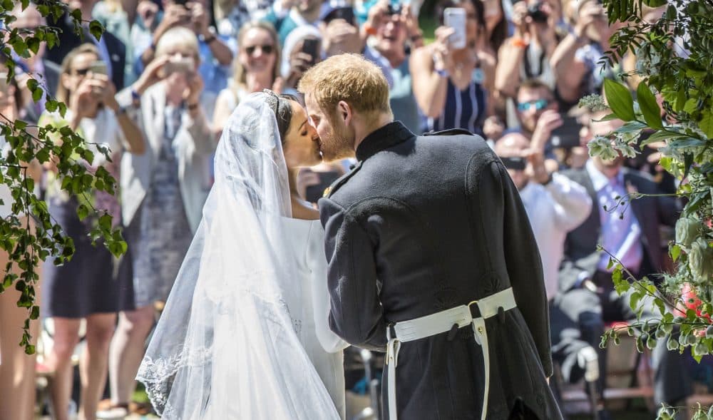 Meghan Markle and Prince Harry kiss on the steps of St George's Chapel at Windsor Castle following their wedding in Windsor Castle in Windsor, near London, England, Saturday, May 19, 2018. (Danny Lawson/AP)