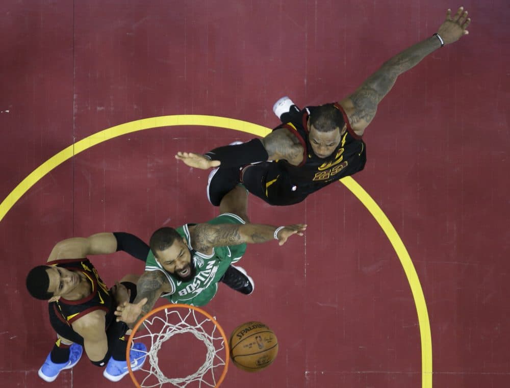 Boston Celtics' Marcus Morris (13) goes for a rebound with Cleveland Cavaliers' Jordan Clarkson (8), left, and LeBron James in the first half of Game 3 of the NBA basketball Eastern Conference finals, Saturday, May 19, 2018, in Cleveland. (Tony Dejak/AP)