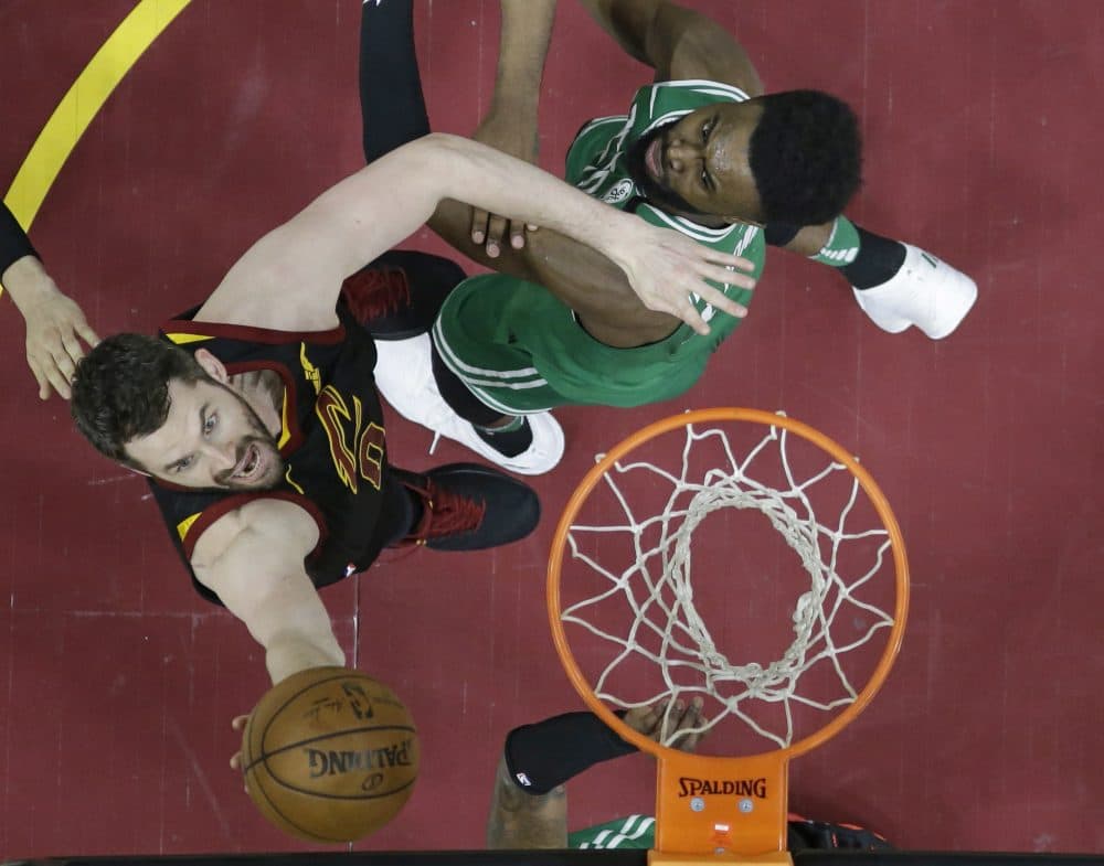 Cleveland Cavaliers' Kevin Love, left, drives to the basket against Boston Celtics' Jaylen Brown in the second half of Game 4 of the NBA basketball Eastern Conference finals, Monday, May 21, 2018, in Cleveland. The Cavaliers won 111-102. (Tony Dejak/AP)