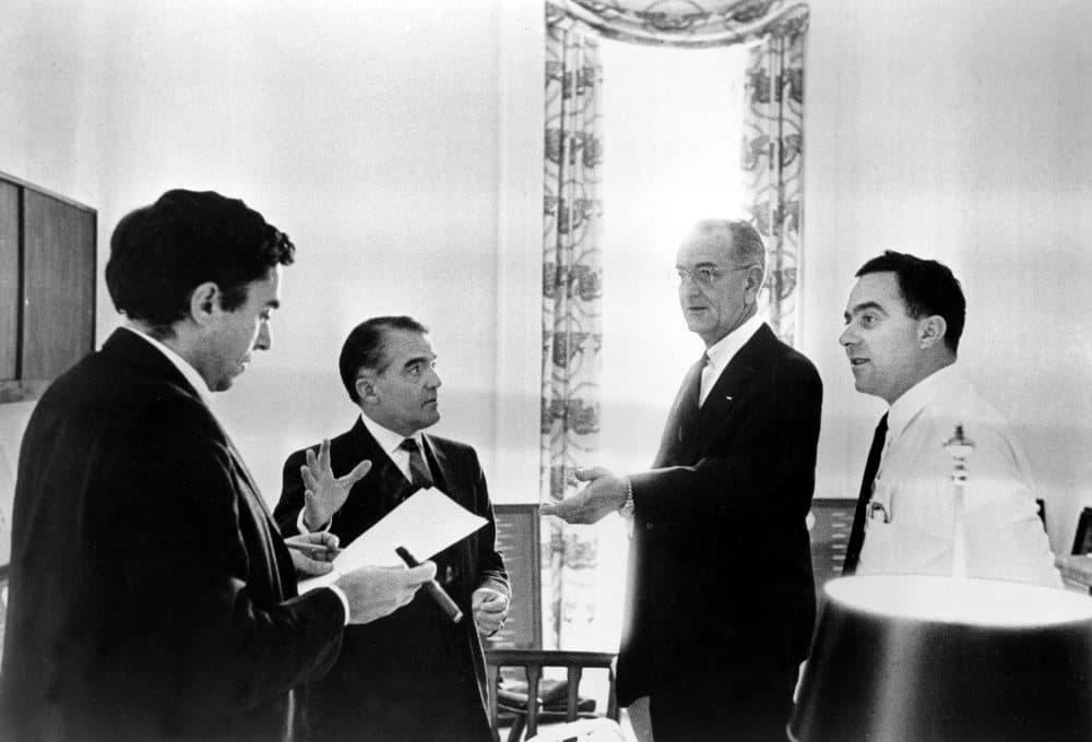 U.S. President Lyndon B. Johnson consults with assistants while drafting the State of the Union address at the White House in Washington, D.C., Jan. 12, 1966.  From left are, Richard Goodwin, former presidential assistant called back from Wesleyan University to help on the speech; Jack Valenti; President Johnson; and Joseph A. Califano, Jr.  (AP Photo/The White House)