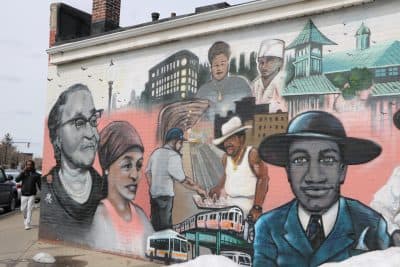A depiction of Melnea Cass, far left, and other neighborhood icons, in the &quot;Faces of Dudley&quot; mural on Washington Street. (Rachel Paiste/WBUR)