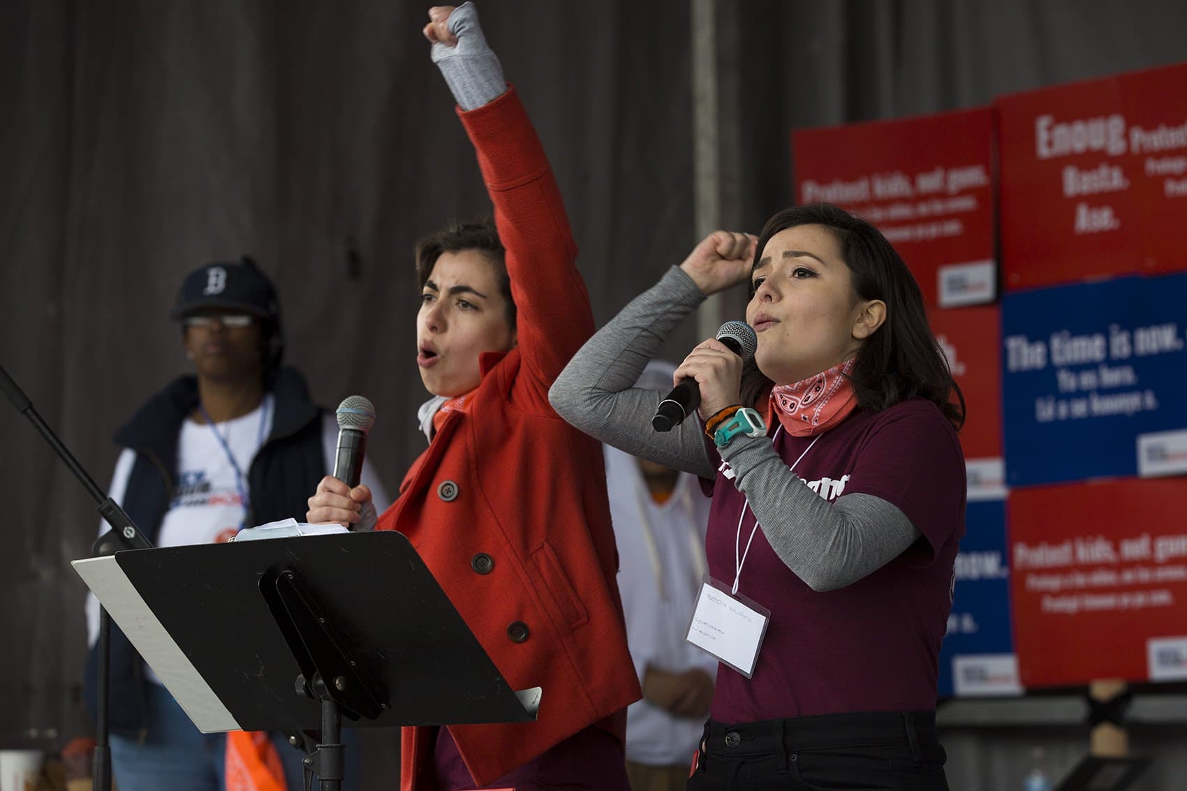 Sisters Leonor Muñoz, left, and Beca Muñoz, right, speak to the large crowd at the Boston Common attending the March for Our Lives rally in March. (Jesse Costa/WBUR)