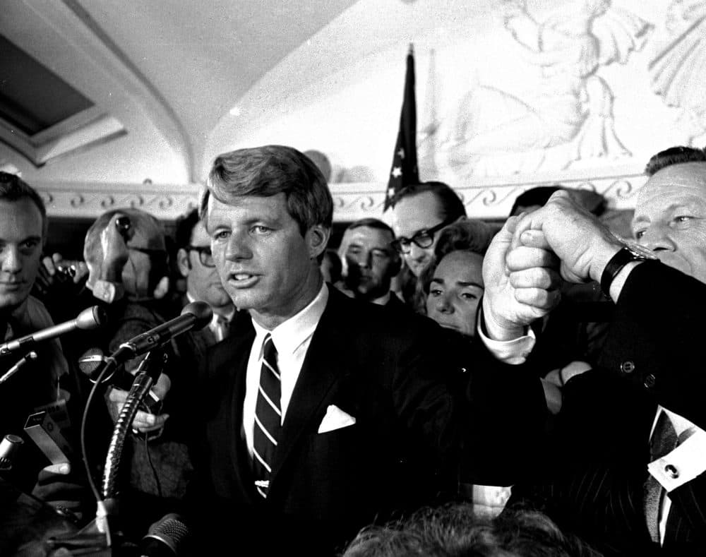 Sen. Robert F. Kennedy addresses a throng of supporters in the Ambassador Hotel in Los Angeles early in the morning of June 5, 1968, following his victory in the previous day's California primary election. A moment later he turned into a hotel kitchen corridor and was critically wounded. His wife, Ethel, is just behind him. (Dick Strobel/AP)