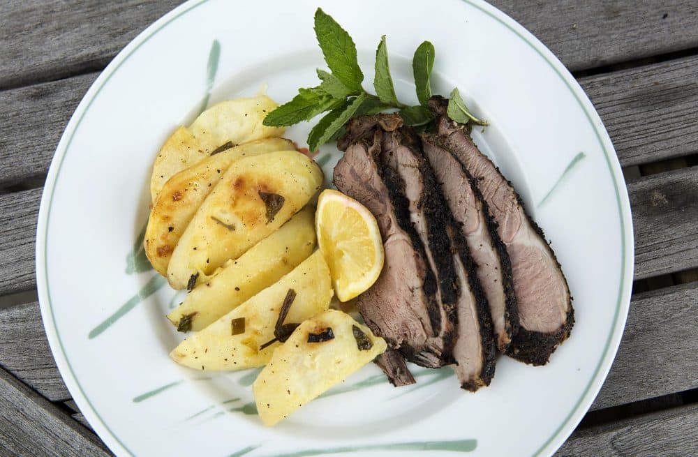 Grilled leg of lamb with Greek-style lemon and oregano potatoes, from chef Kathy Gunst. (Robin Lubbock/WBUR)