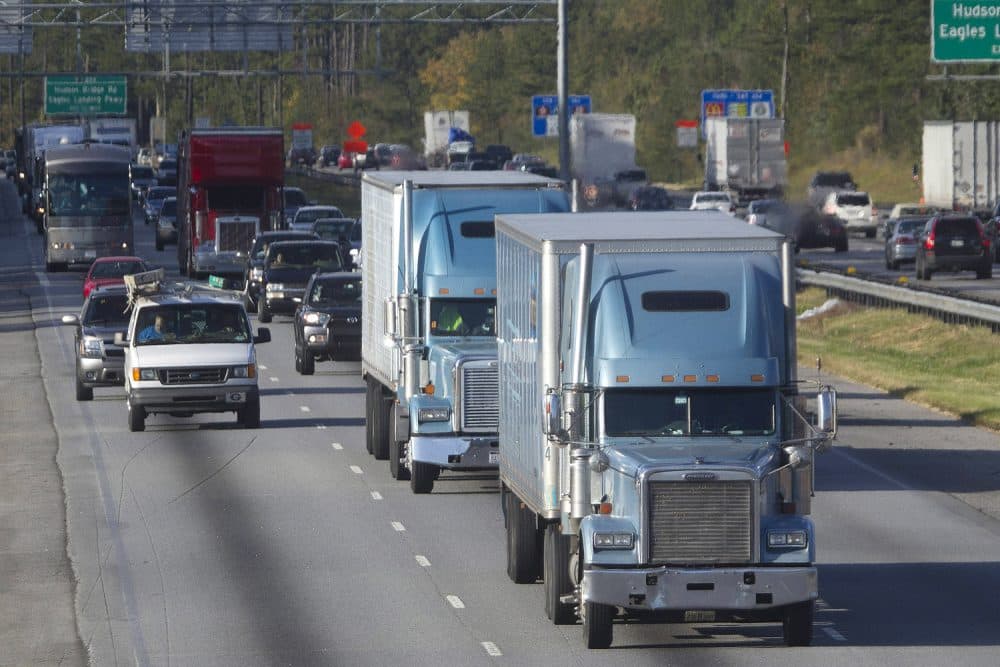 In this photo taken Monday, Oct. 29,, 2012 trucks travel along Interstate 75 near Stockbridge, Ga. (John Bazemore/AP)