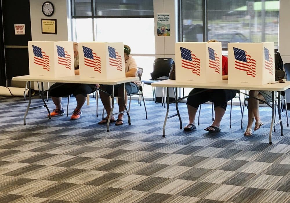 Voters fill out primary ballots at a Polk County polling place at East Side Library in Des Moines, Iowa, Tuesday, June 5, 2018. (Scott Stewart/AP)