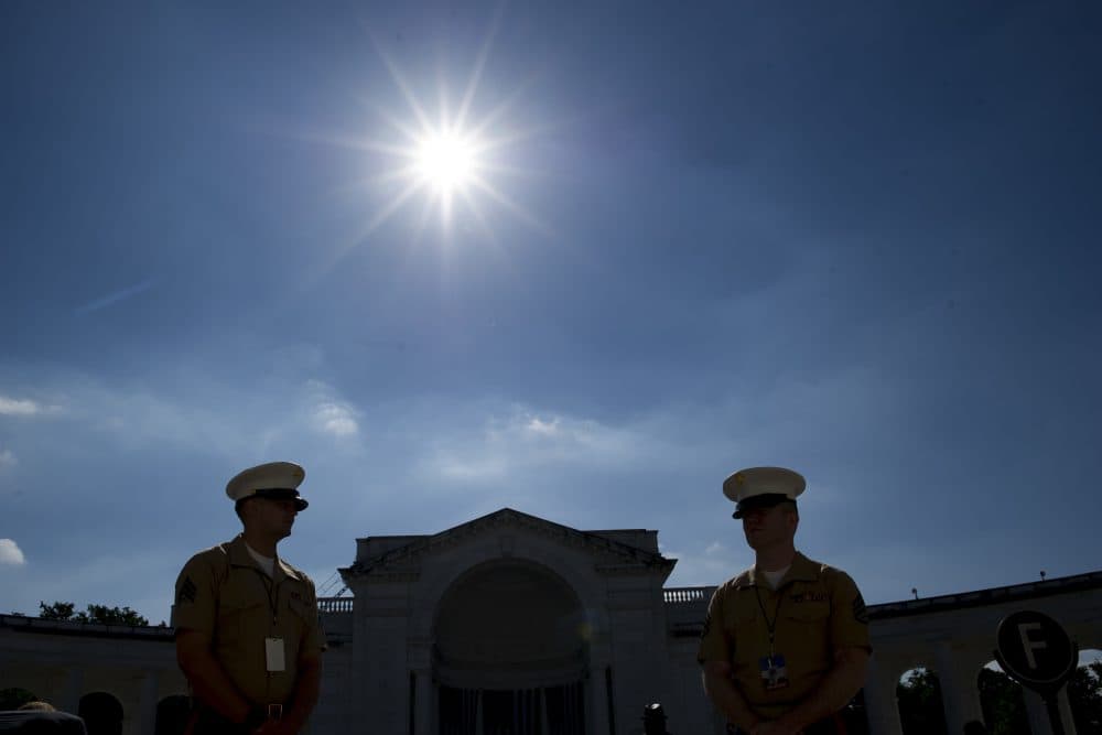 Marine Corps Sgts. wait to direct attendees to their seats at the Celebration of the Life of Robert F. Kennedy at Arlington National Cemetery in Arlington, Va., where the Navy veteran is buried. (Cliff Owen/AP)