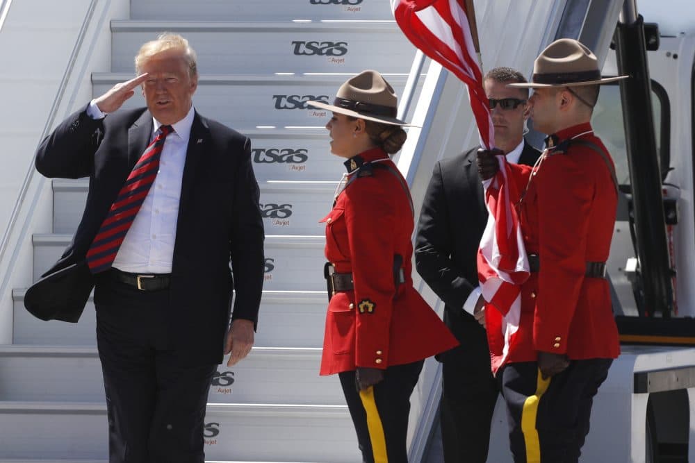 President Trump salutes as he arrives at Canadian Forces Base Bagotville, Canada, on June 8, 2018, as he travels to attend the G-7 summit. (Lars Hagberg/AFP/Getty Images)