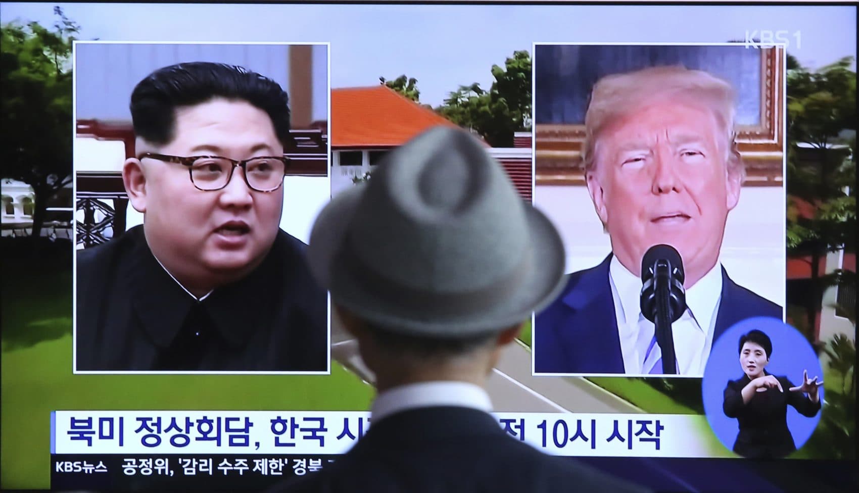 A man watches a TV screen showing file footage of U.S. President Donald Trump, right, and North Korean leader Kim Jong Un during a news program at the Seoul Railway Station in Seoul, South Korea, Monday, June 11, 2018. Final preparations are underway in Singapore for Tuesday's historic summit between President Trump and North Korean leader Kim, including a plan for the leaders to kick things off by meeting with only their translators present, a U.S. official said. The signs read: &quot;Summit between the United States and North Korea.&quot; (Ahn Young-joon/AP)