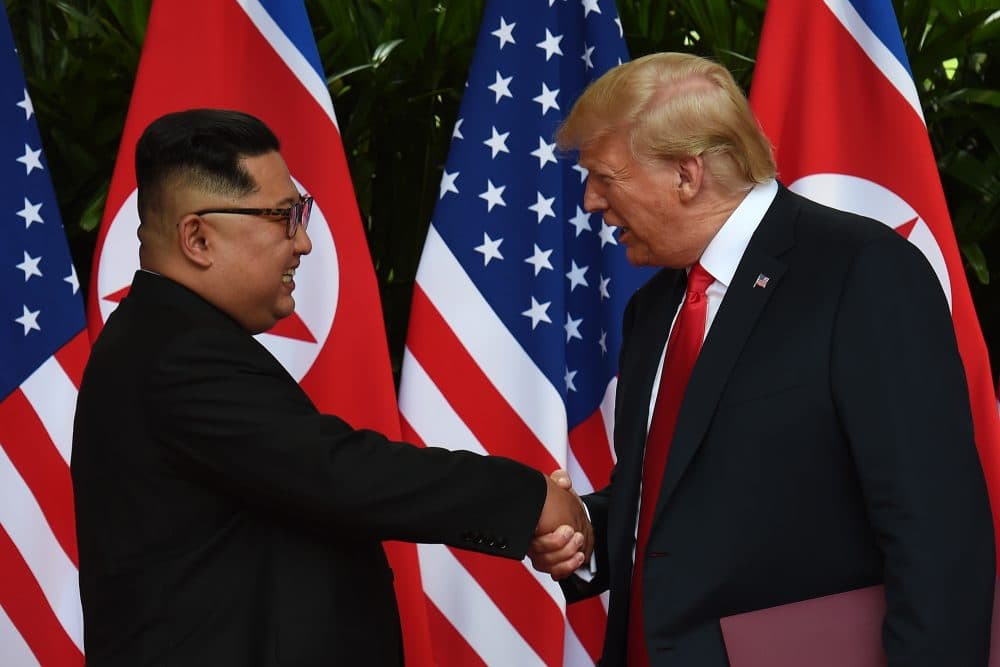 North Korea's leader Kim Jong Un shakes hands with President Trump after taking part in a signing ceremony at the end of their historic summit at the Capella Hotel on Sentosa island in Singapore on June 12, 2018. (Anthony Wallace/AFP/Getty Images)