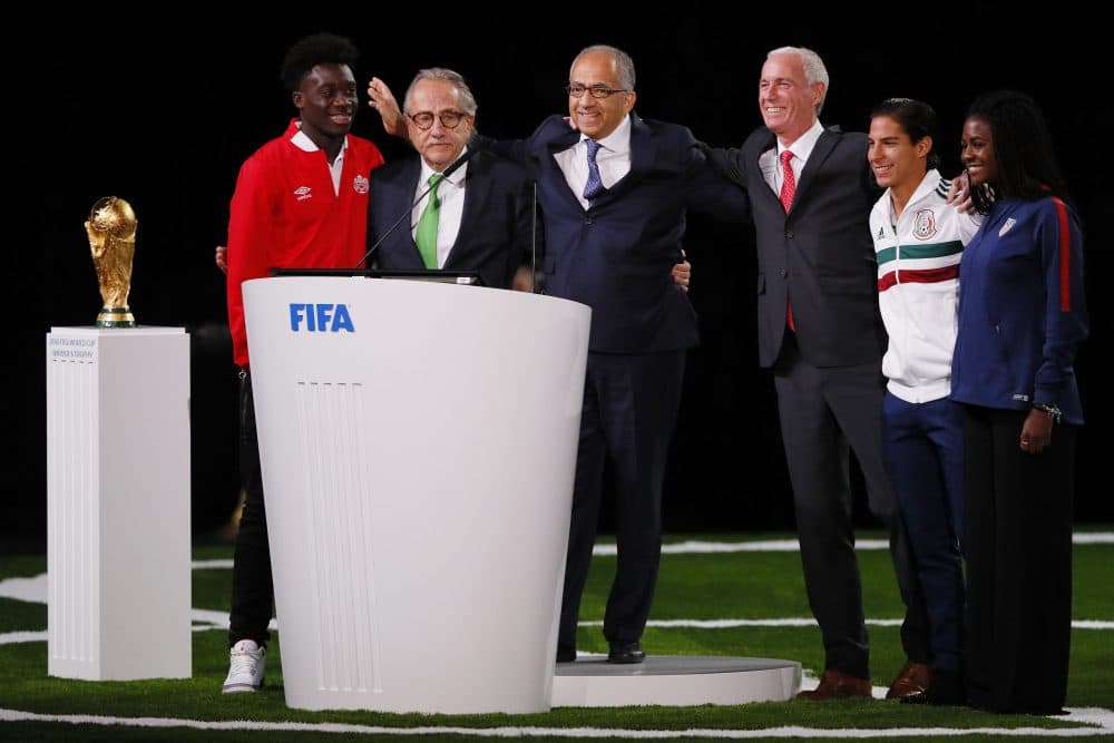 The succesful United 2026 bid (Canada, Mexico and the U.S.) officials pose on stage. (Kevin C. Cox/Getty Images)