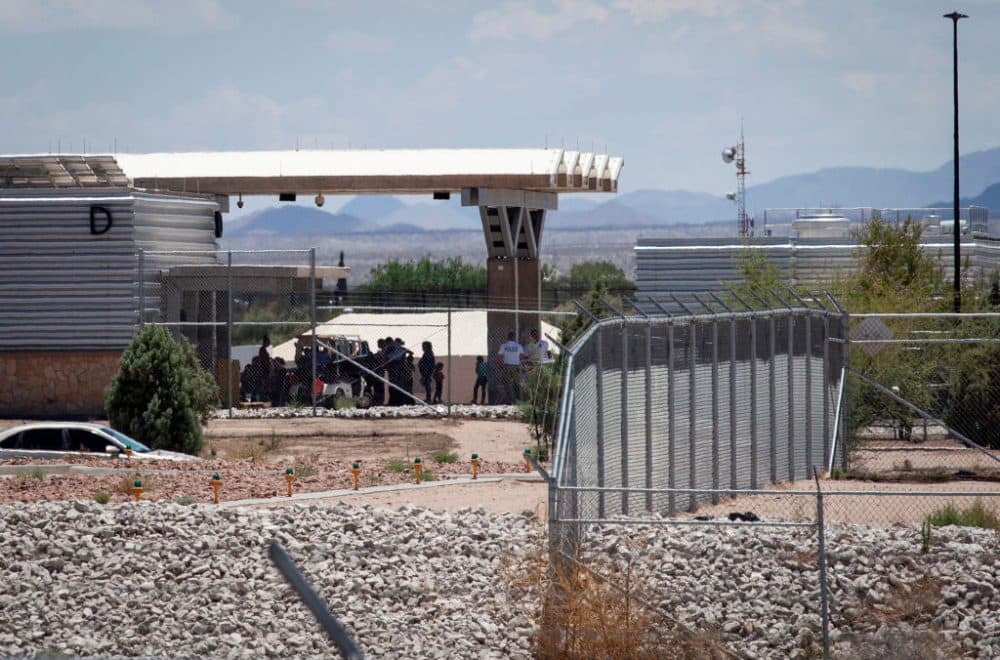 People wait outside the Tornillo-Marcelino Serna Port of Entry, where tents have been built to house unaccompanied migrant children on June 18, 2018 in Tornillo, Texas. The Trump Administration's &quot;zero-tolerance&quot; immigration policy has led to an increase in the number of migrant children who have been separated from their families at the southern U.S. border. (Christ Chavez/Getty Images)