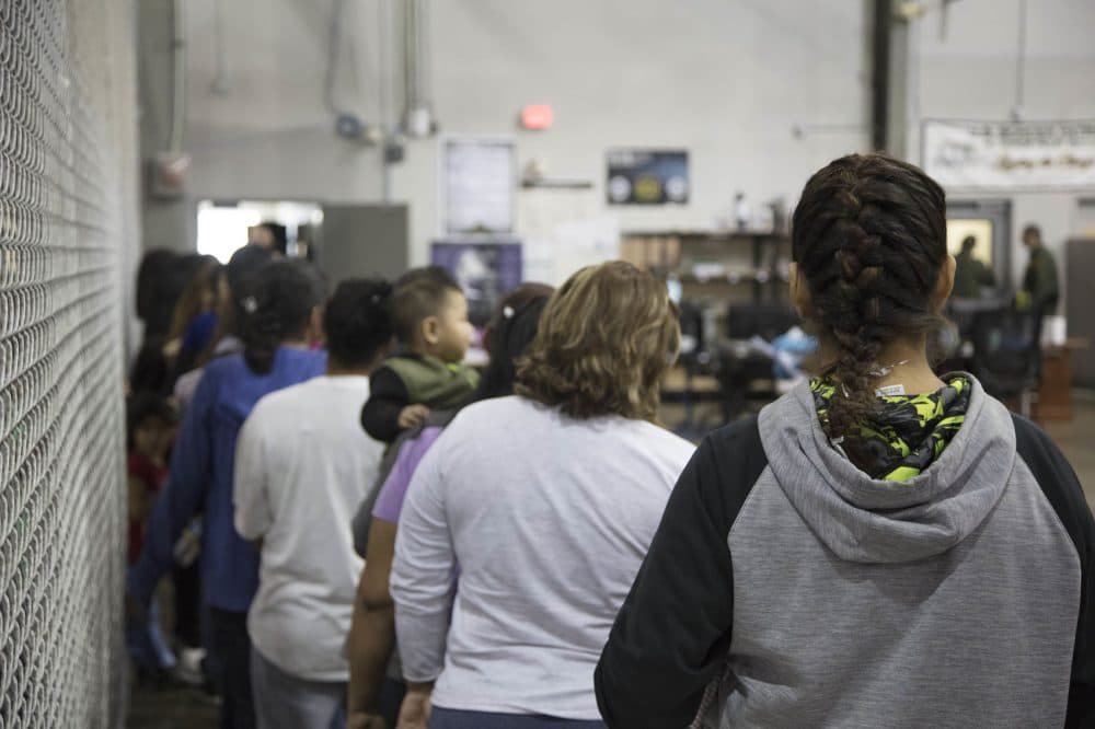 In this handout photo provided by U.S. Customs and Border Protection, U.S. Border Patrol agents conduct intake of people who have crossed the border illegally at the Central Processing Center on June 17, 2018 in McAllen, Texas. (U.S. Customs and Border Protection via Getty Images)
