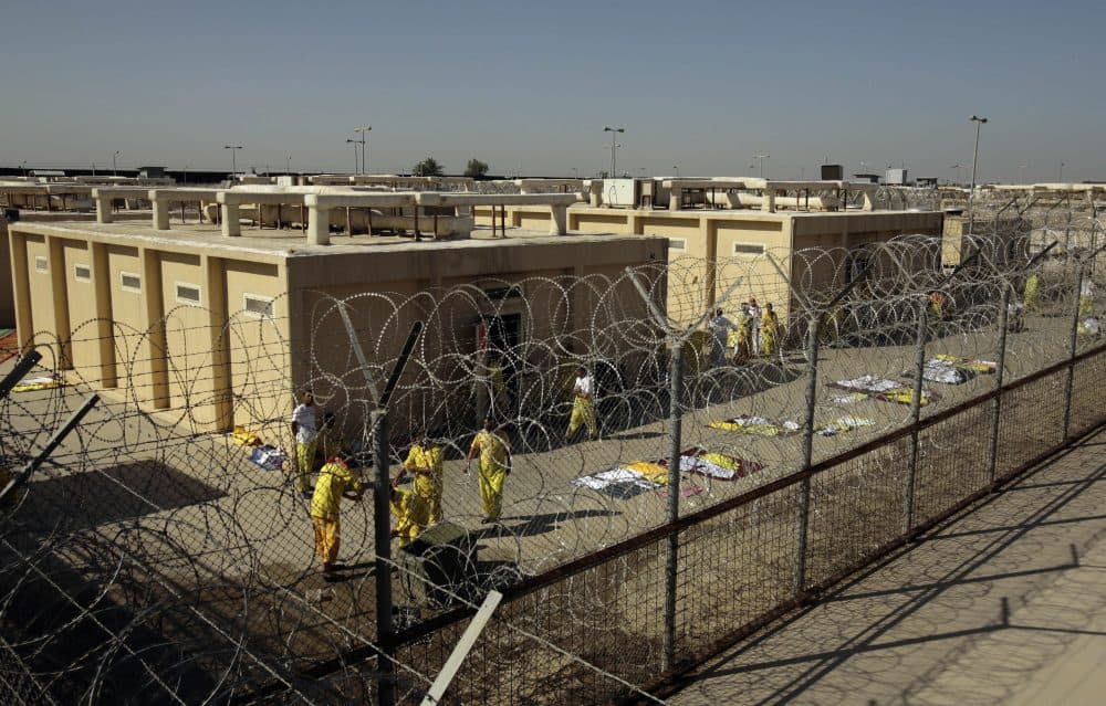 In this Nov. 10, 2008 file photo, detainees are seen outside their cell block at the U.S. detention facility at Camp Cropper in Baghdad, Iraq. (Maya Alleruzzo, File/AP)