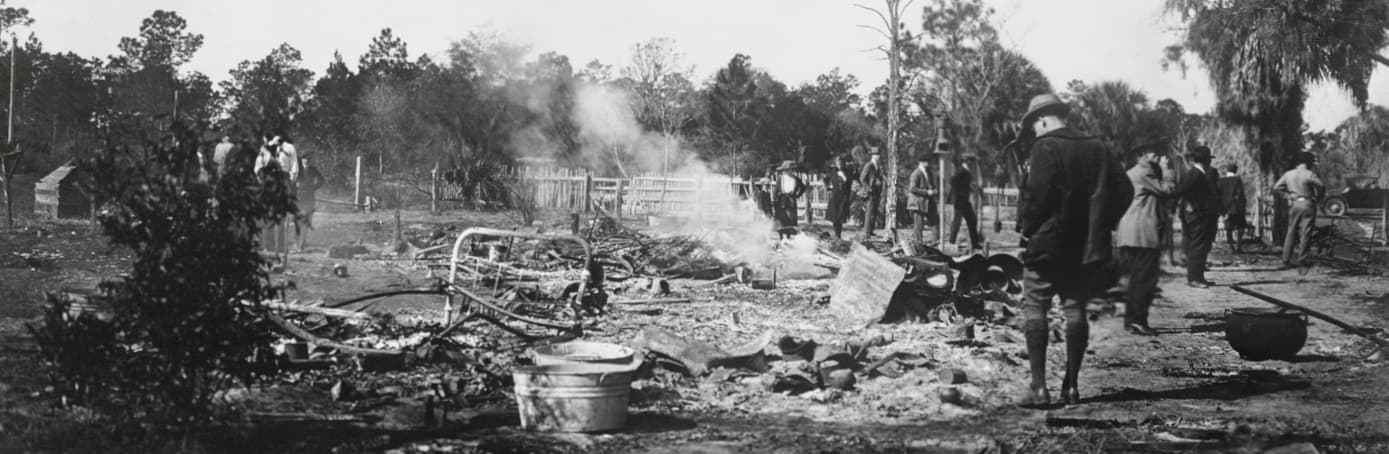 The ruins of a burned African-American home in Rosewood, Fla., in 1923. Rosewood was a thriving African-American community, until a dispute led to a massacre of at least eight people, and the town was burned and destroyed. (Courtesy State Library & Archives of Florida)