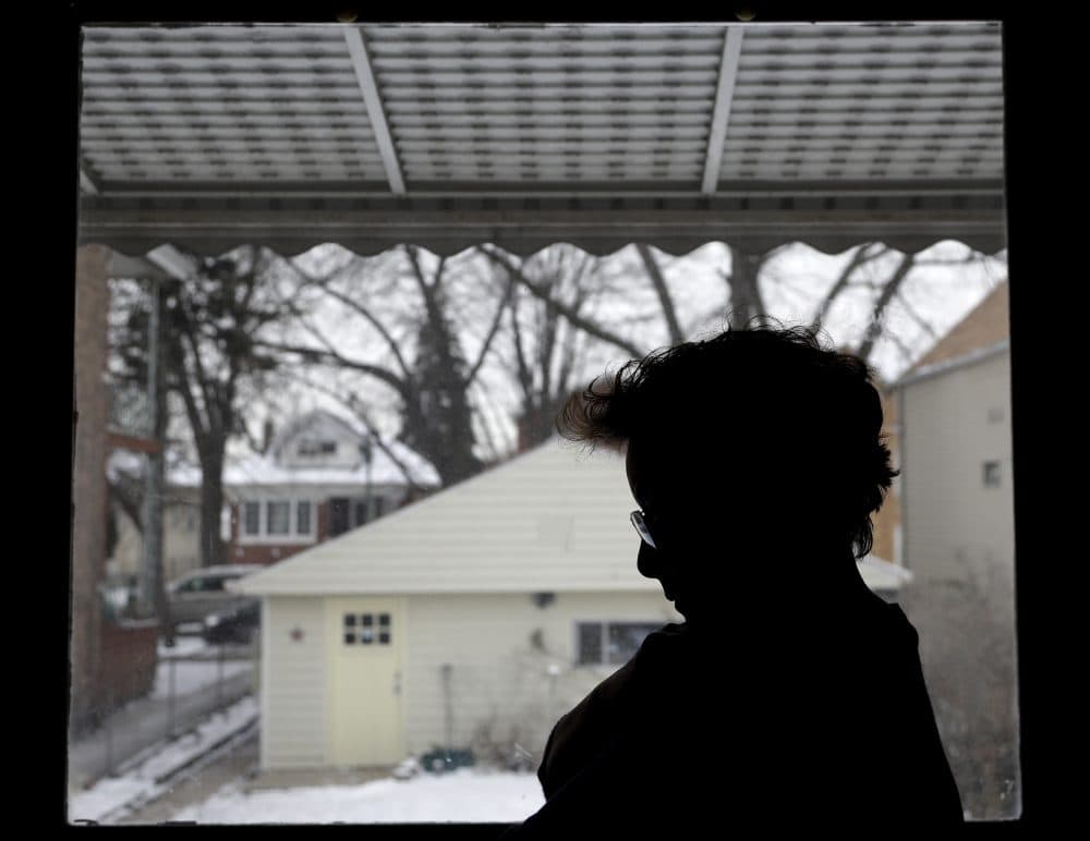 In this Thursday, Dec. 28, 2017, photo, Isabel Escobar stands in front of window at her home in Chicago. Escobar, who was born in Guatemala, has cleaned homes for years in the U.S. and has suffered sexual harassment on the job. Unions and worker associations say that immigrant women who clean offices, hotels or homes suffer sexual harassment often but hardly report it because of fear of losing their jobs or fear of being deported. (Nam Y. Huh/AP)