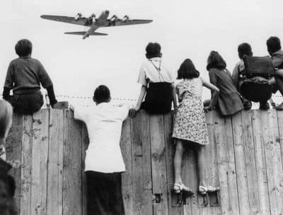 West Berlin children at Tempelhof airport watch fleets of U.S. airplanes bringing in supplies to circumvent the Russian blockade in this undated photo. The airlift began June 25, 1948, and continued for 11 months. (AP Photo)