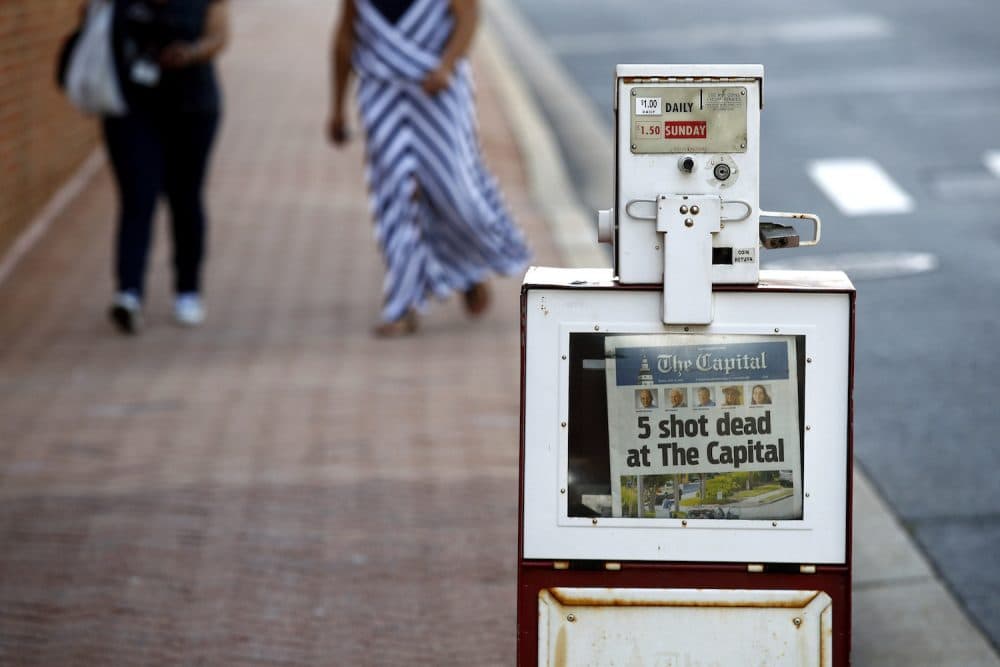 A Capital Gazette newspaper rack displays the day's front page, Friday, June 29, 2018, in Annapolis, Md. (Patrick Semansky/AP)