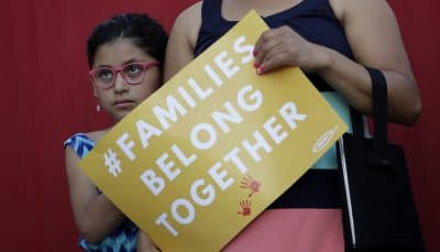 A girl stands with her mother during a Rally For Our Children event to protest a new &quot;zero-tolerance&quot; immigration policy that has led to the separation of families, Thursday, May 31, 2018, in San Antonio. (Eric Gay/AP)