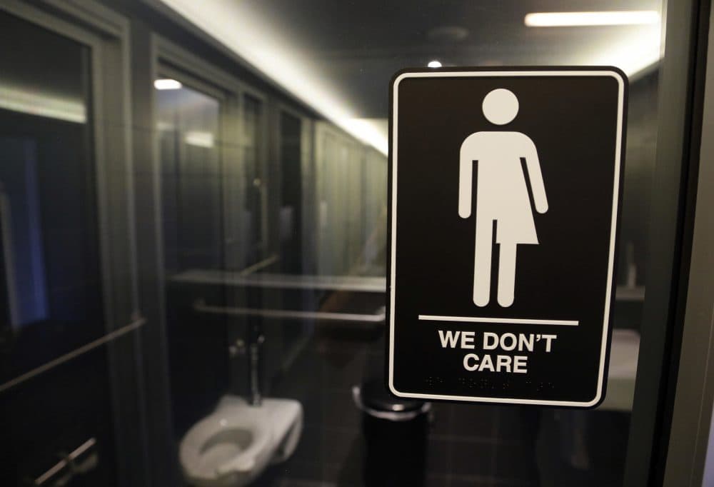 In this May 12, 2016, file photo, signage hangs outside a restroom at 21c Museum Hotel in Durham, N.C. (Gerry Broome/AP)