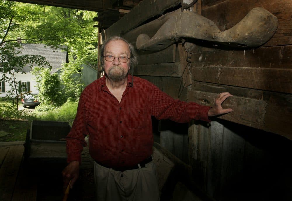 In this June 13, 2006, file photo, Donald Hall, author of numerous poetry books, poses in the barn of the 200-year-old Wilmot farm that has been in his family for four generations. Hall, a prolific, award-winning poet and man of letters widely admired for his sharp humor and painful candor about nature, mortality, baseball and the distant past, died at age 89. (Jim Cole/AP)